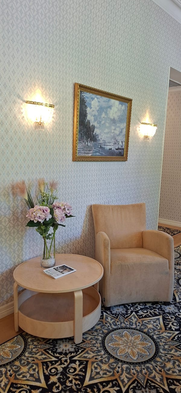 Lahti summer morning: park, gardens, and a hotel interior