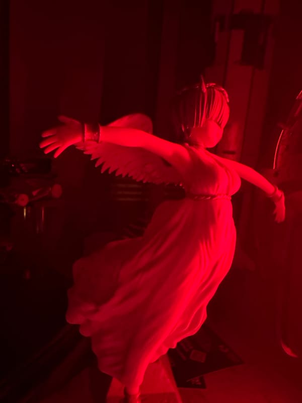 Gaming workspace documented with red lighting and equipment setup
