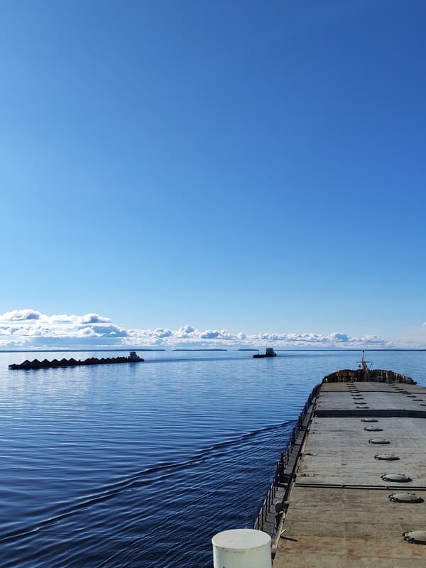 Tugboat tows cargo barge across Russian waters near Mikhalevo