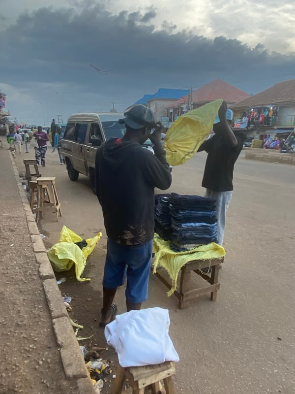Afternoon street life and commerce in Bukuru's market district