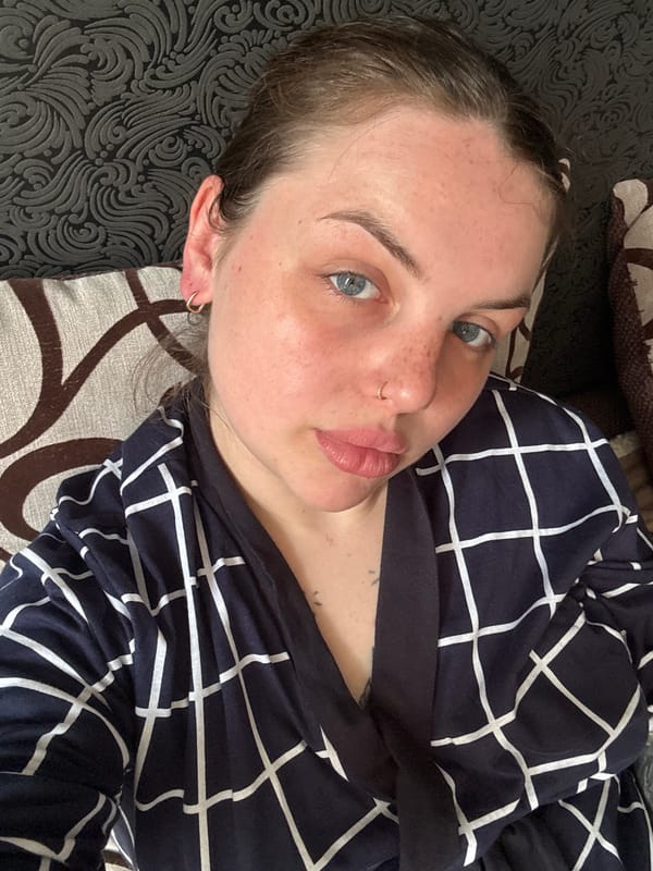 Woman makes playful expressions while resting indoors in Ukraine