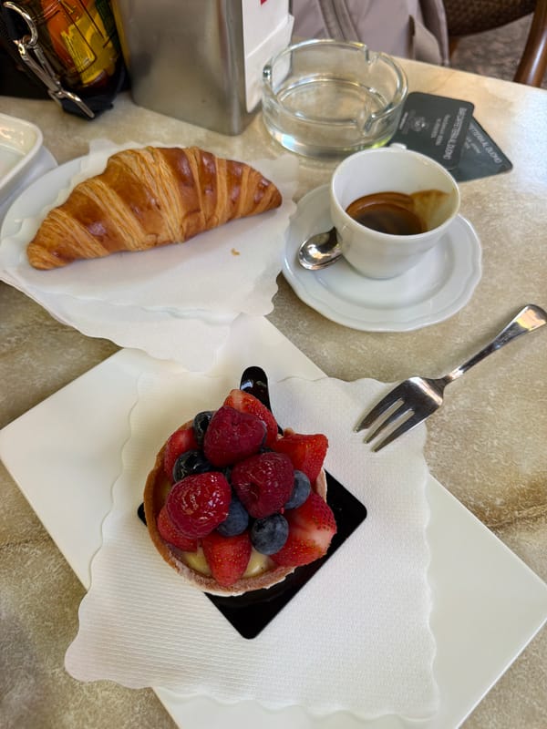Fruit tart and coffee at a Verona café near the Duomo