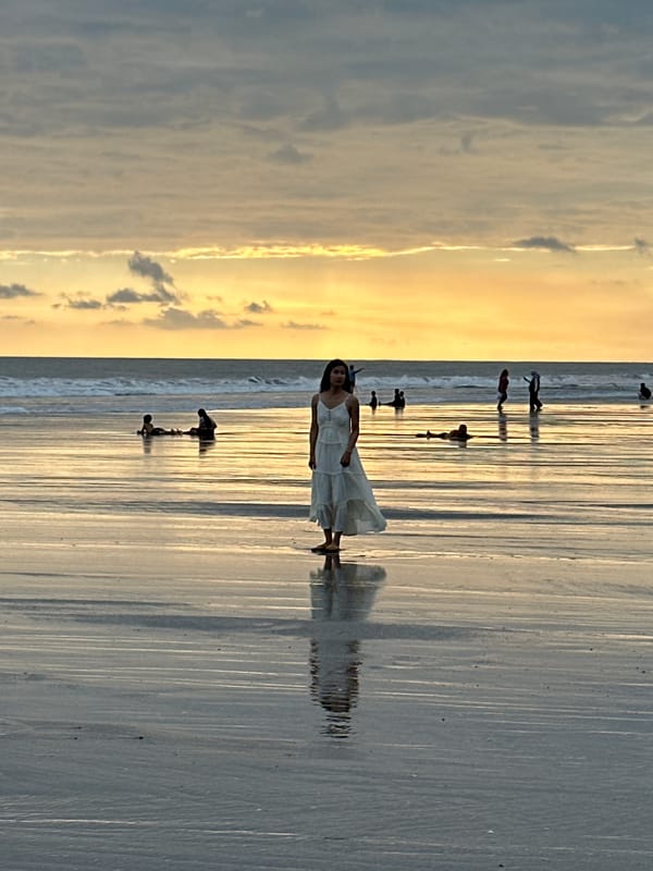 Busy North Kuta beach sunset with families and a photo shoot