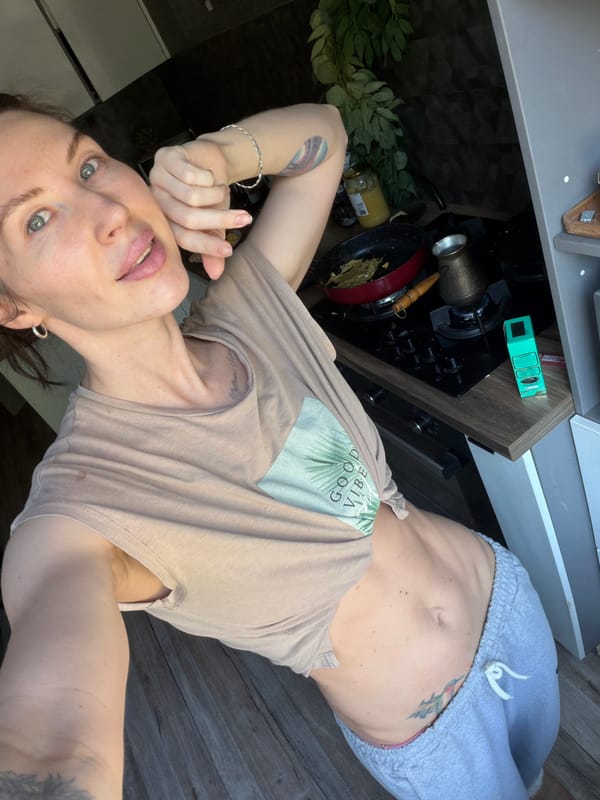 Woman takes morning selfie in Good Vibes shirt in Perm