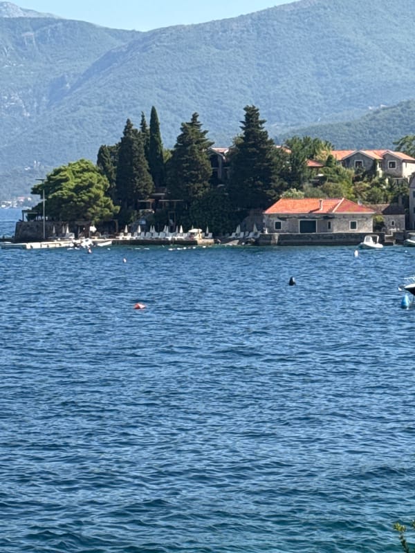 Morning at a Mediterranean waterfront with boats and selfies