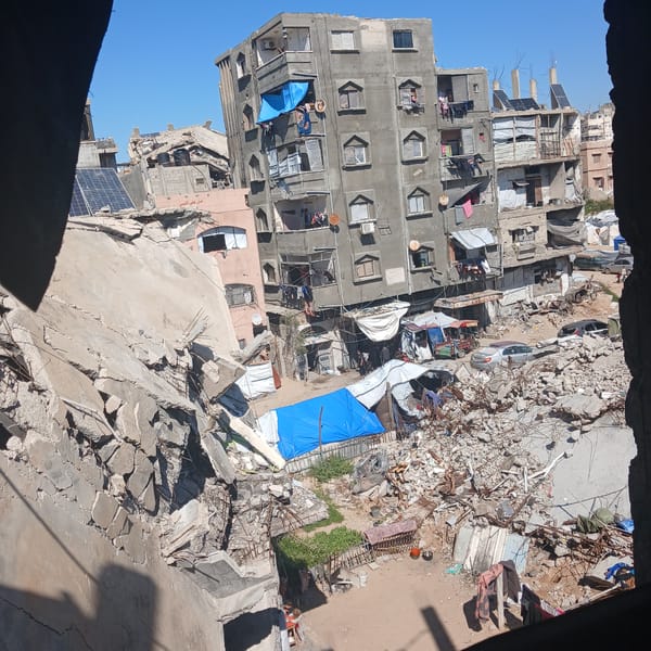 Outdoor cooking documented amid damaged buildings in Gaza City