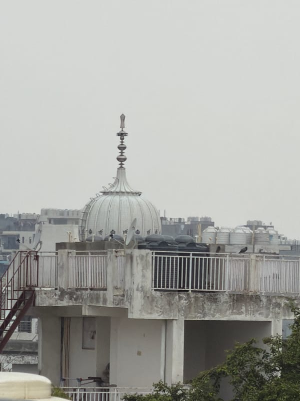 Rooftop panorama of Delhi's dense skyline, Qutub Minar in view