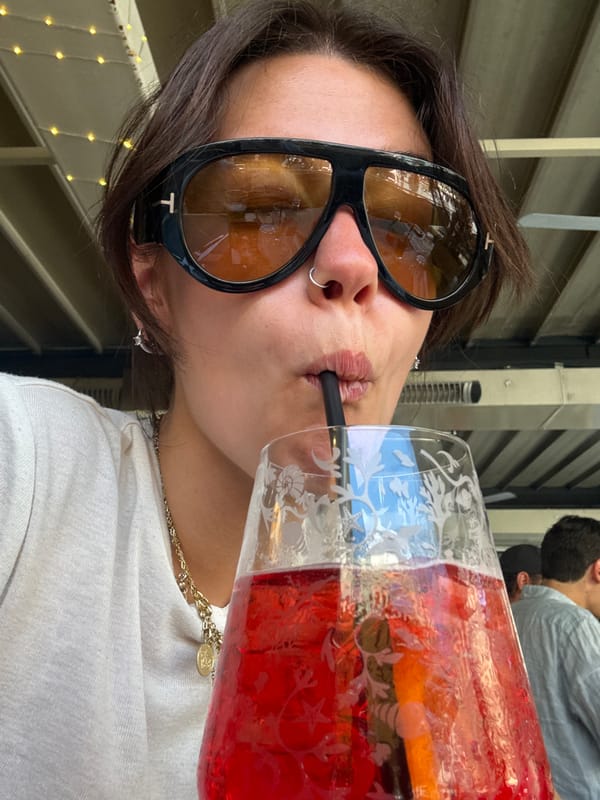 Tourist enjoys drinks at Florence cafe during afternoon break