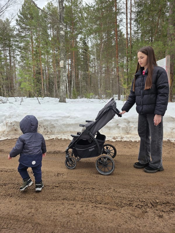 Park visitors navigate snowy paths in Novyi, Russia