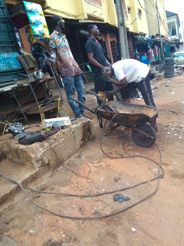 Auto repair workers busy in Onitsha scrapyards and workshops