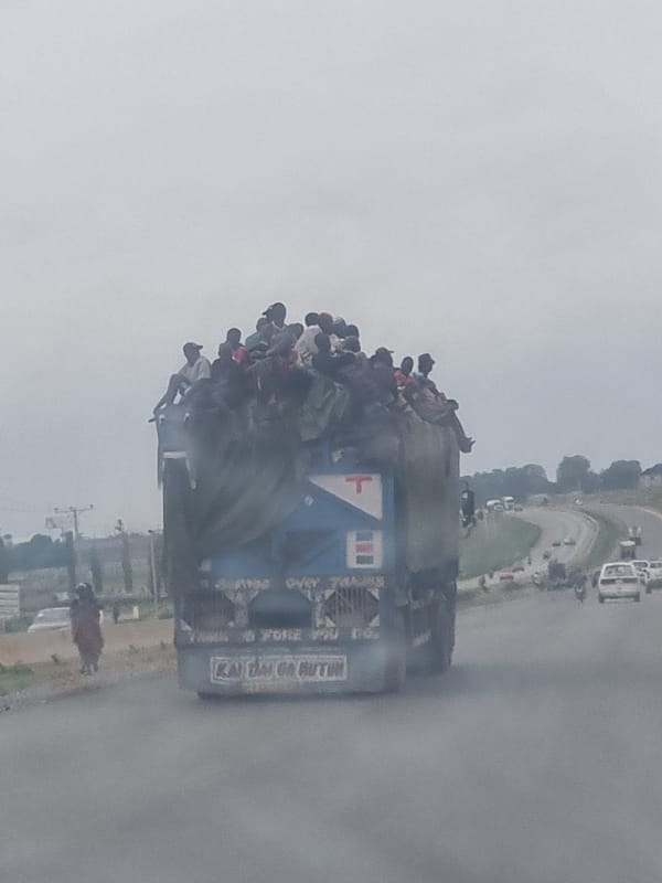 Loaded passenger truck travels through Pasere, Nigeria