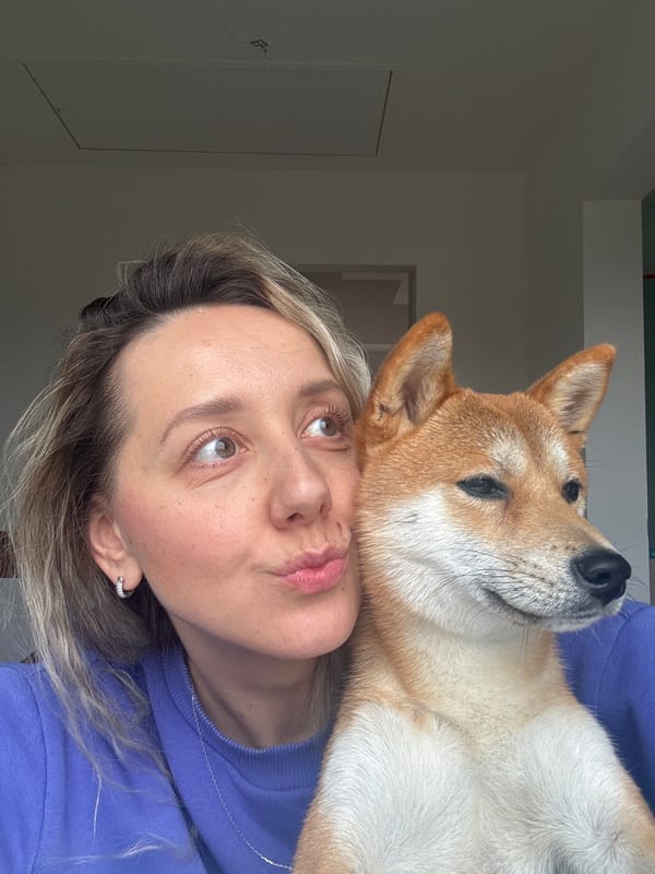 Woman and Shiba Inu captured in playful moments in Latvia