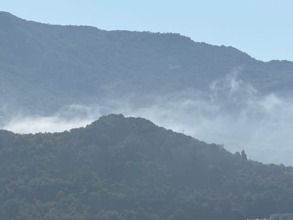 Beach, ruins, and mountain mist in coastal Montenegro