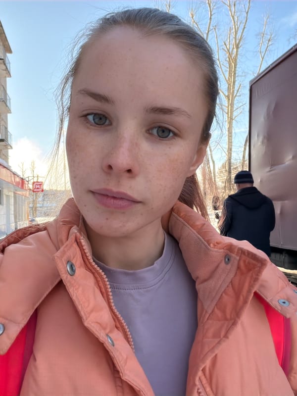 Young woman documents sunny spring day in Berezniki, Russia