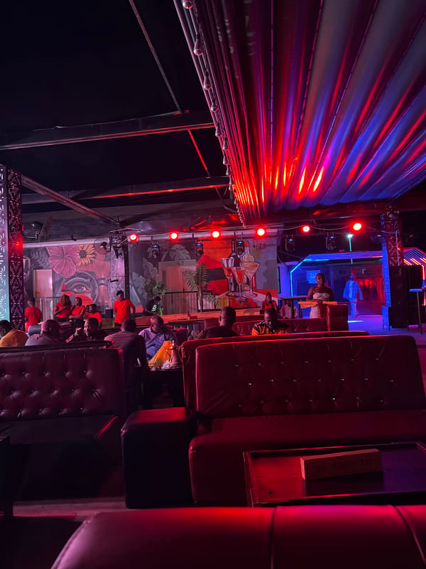 Night venue in Howayi lit up with DJ setup and lounge areas