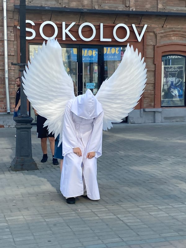 Angel costume, live clarinet, and street life in central Yekaterinburg