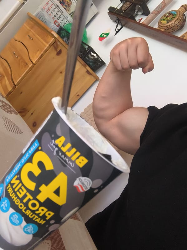 Person flexes bicep with protein yogurt in Bulgaria