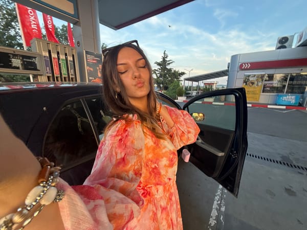 Woman takes playful selfies at Burgas gas station