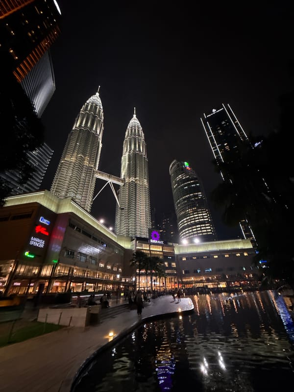 Petronas Twin Towers captured illuminated at night in Kuala Lumpur