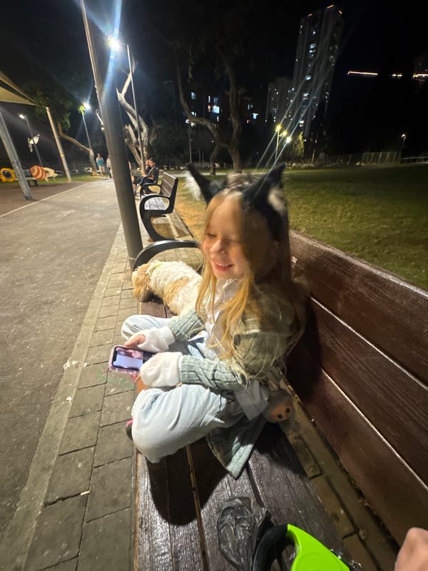 Girl spends afternoon with dog in Bat Yam park