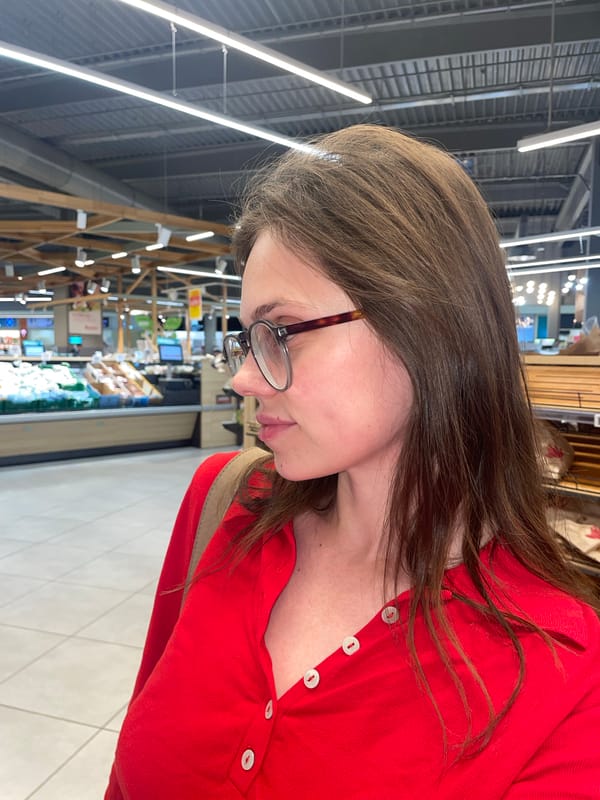Woman shops at grocery store in Budaörs, Hungary