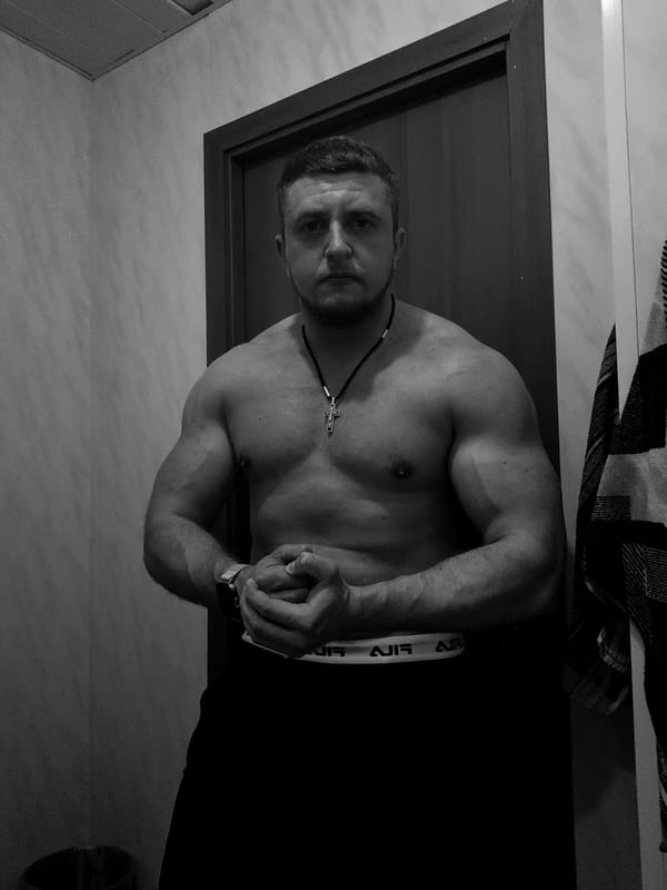 Man photographed posing in bathroom, location unknown