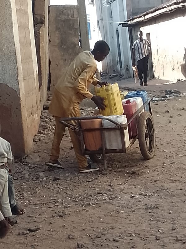 Everyday street scenes, people moving and resting outdoors