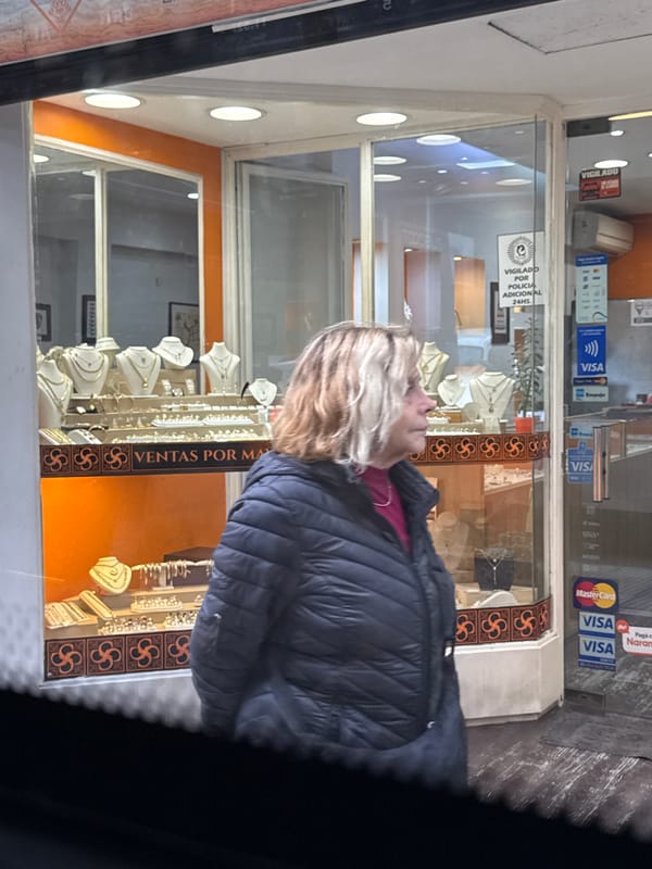 Woman window shops jewelry stores in Buenos Aires