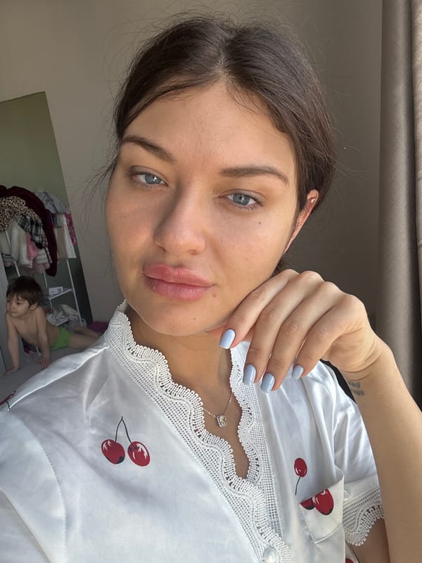 Woman in cherry-patterned top photographed in Moscow