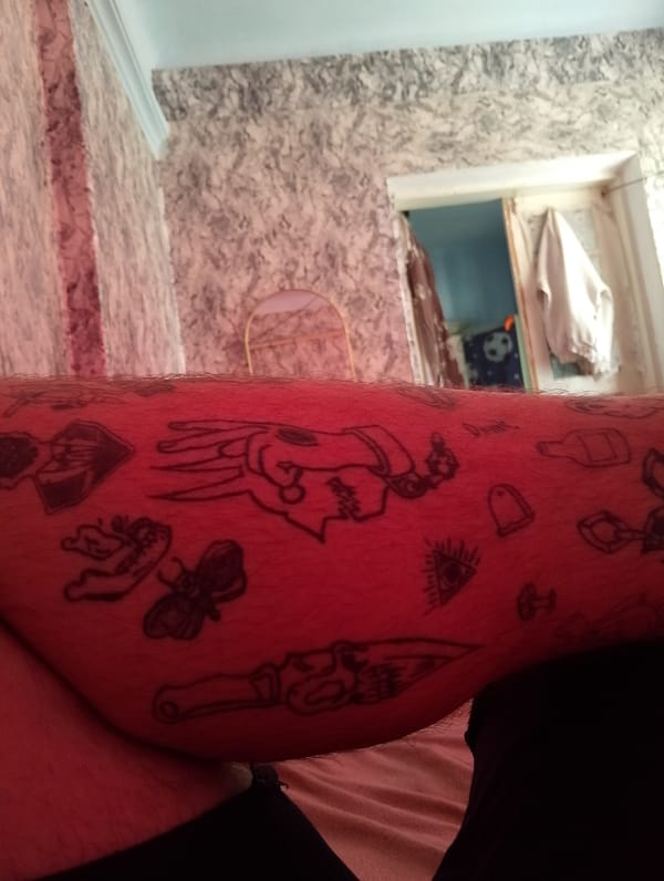 Tattooed man documents bedroom selfie session in Moldova village