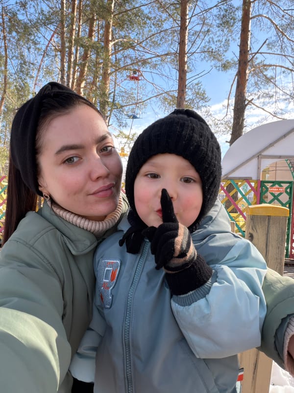 Mother and child enjoy sunny winter morning at Chaikovsky Park
