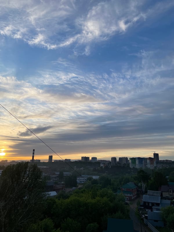 Sunset captured over Izhevsk cityscape with dramatic cloud formations