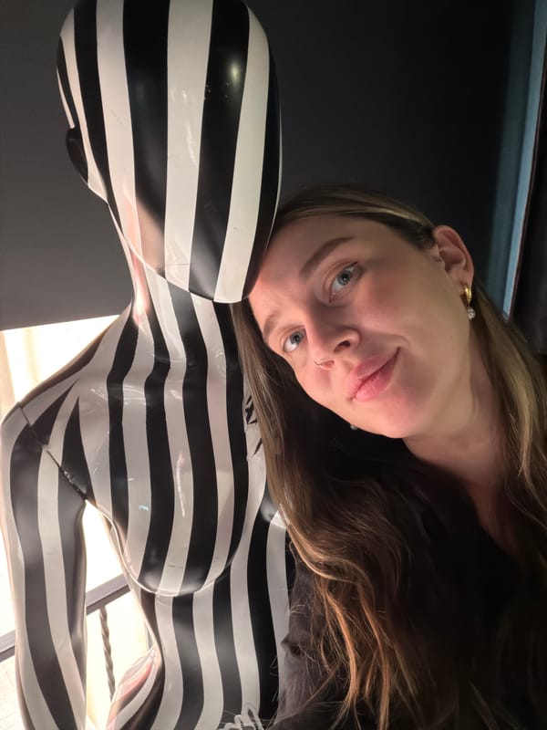 Woman photographed with art sculpture in Moscow indoor venue