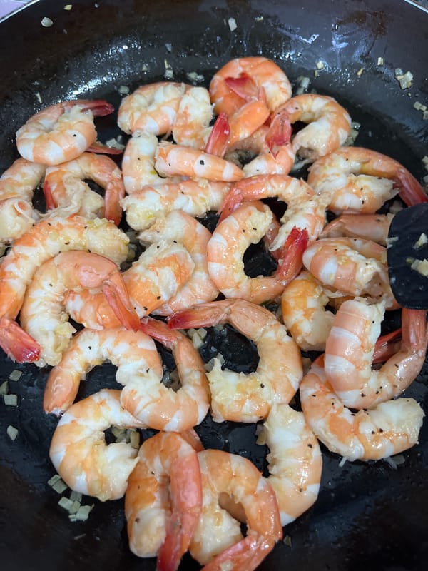 Seasoned shrimp cooked in pan in Mexico neighborhood