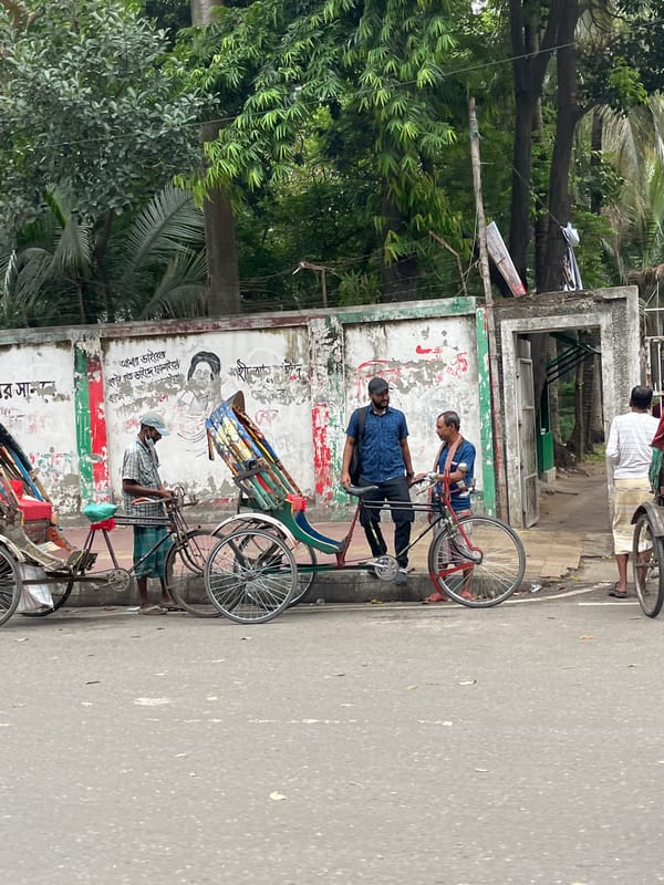 Daily life documented around Dhaka monuments and streets