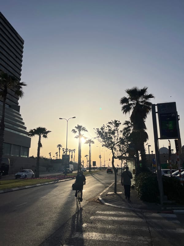 Tel Aviv residents document sunset street life, aircraft overhead