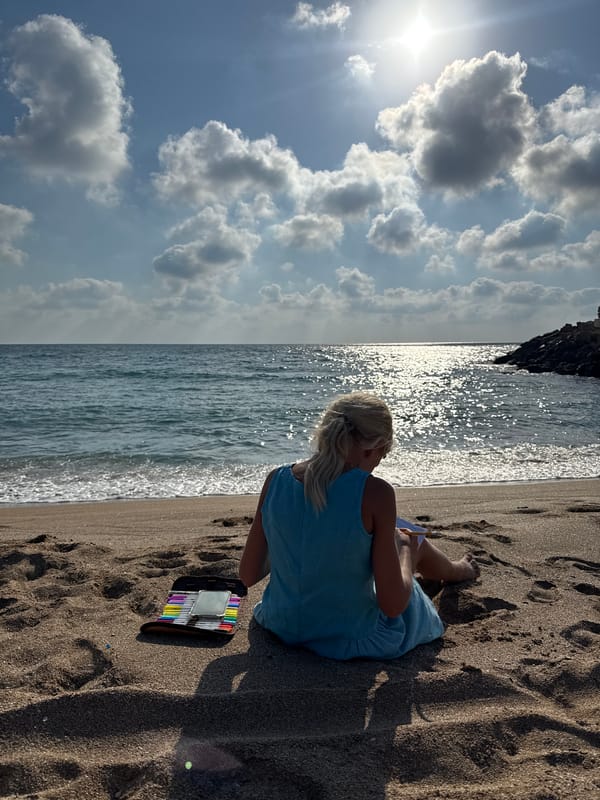 Sketching or writing by the sea on a Nahariyya beach