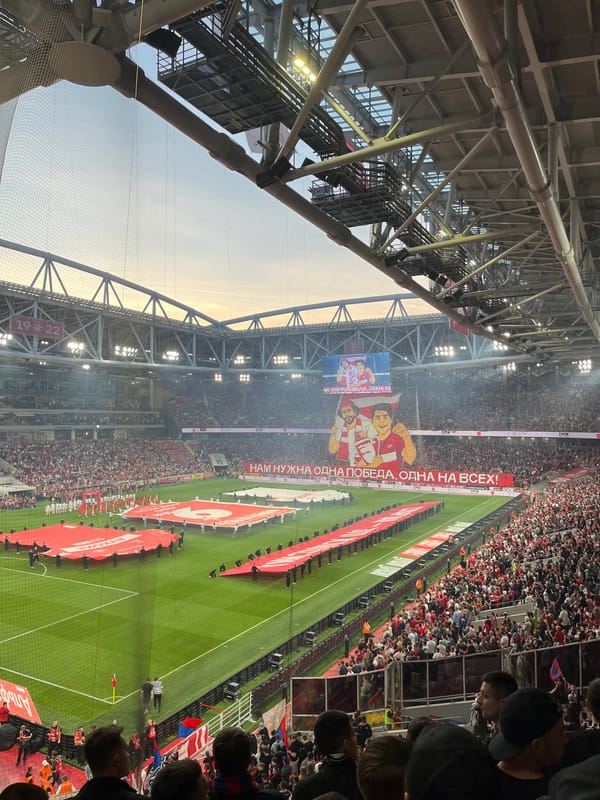 Packed Khimki stadium displays banner before sports event