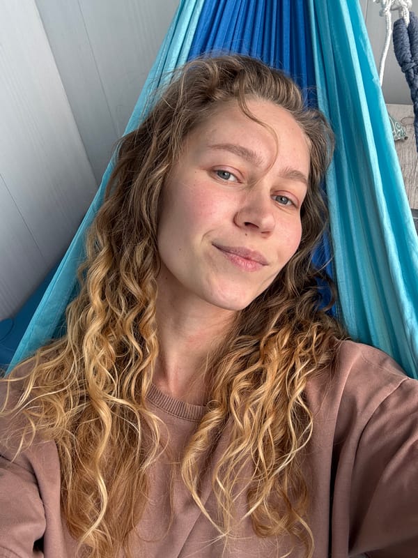Woman rests in hammock during quiet morning in Kladovitsy