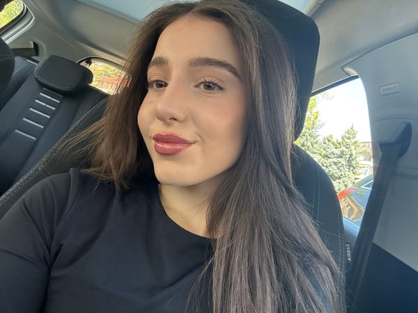 Woman takes selfies in car during morning photo session