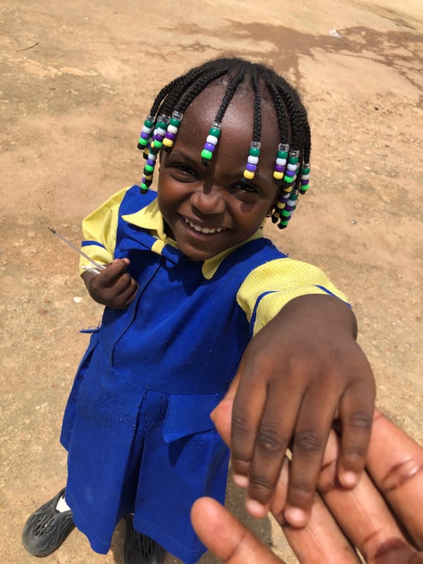 School uniform, beaded braids, and street vibes in Jos