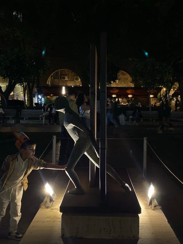 Evening stroll captures illuminated Yerevan landmarks and cityscape