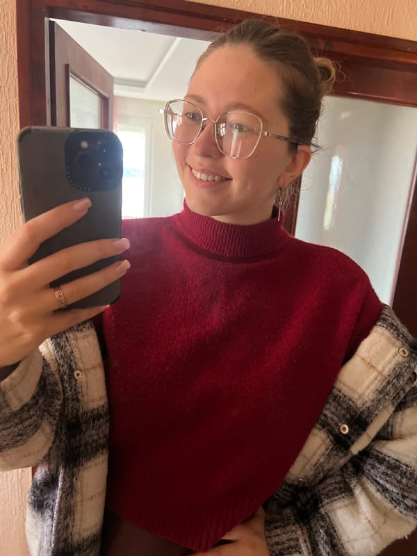 Woman takes mirror selfie in Podgorica room
