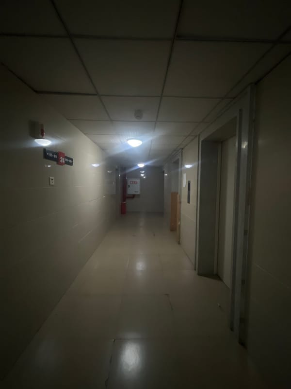 Nighttime building-to-street journey documented in Jiulongpo District