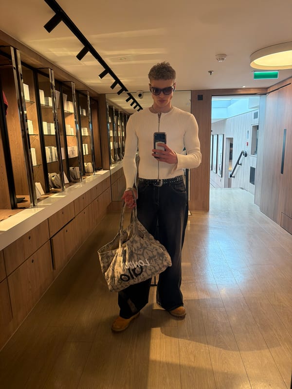 Man shops and takes selfies at London clothing store