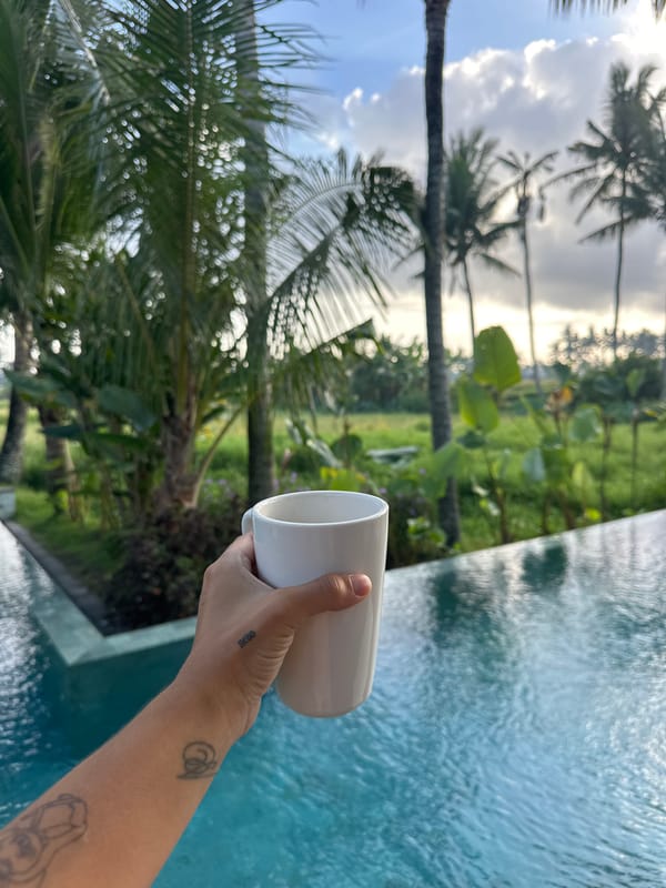 Morning coffee by tropical pool in Sukawati, Indonesia
