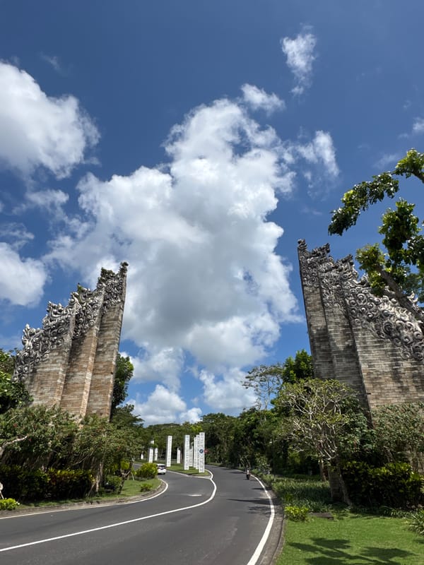 Morning street maintenance and tourist activity in Ungasan