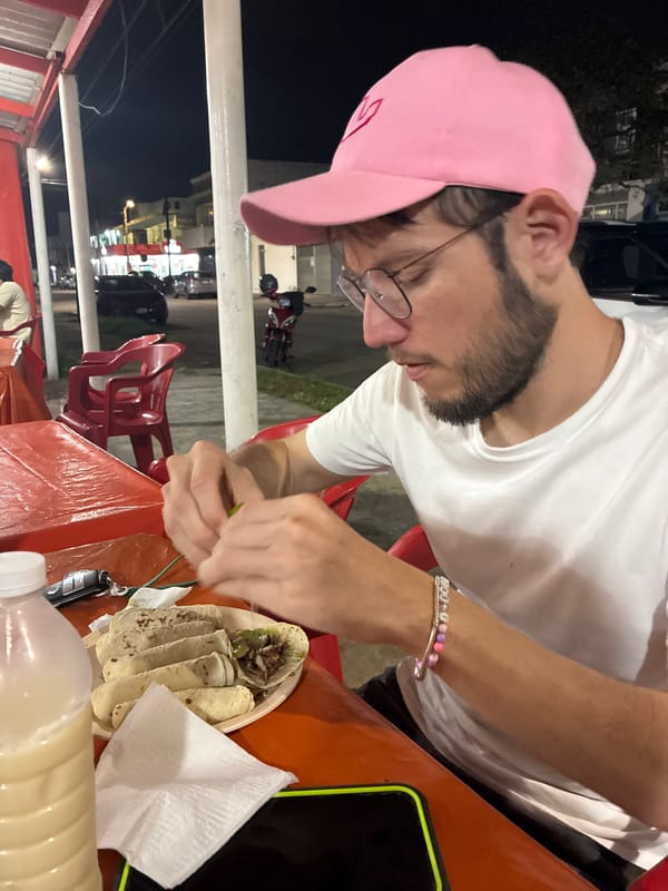 Man enjoys tacos at casual restaurant in Coatzacoalcos