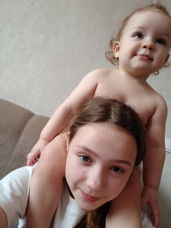 Children pose for casual family photos at home in Krasnodar