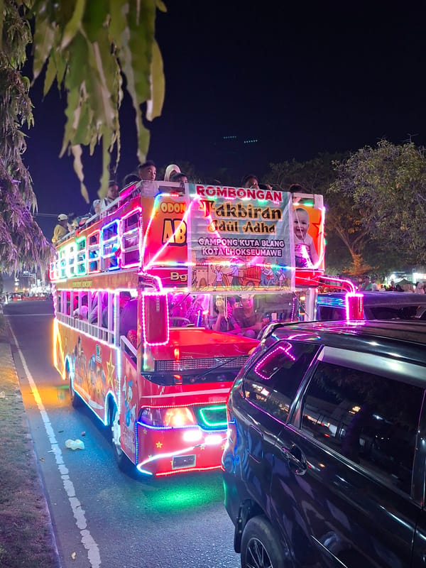 Nighttime parade with decorated vehicles draws crowds in Lhokseumawe